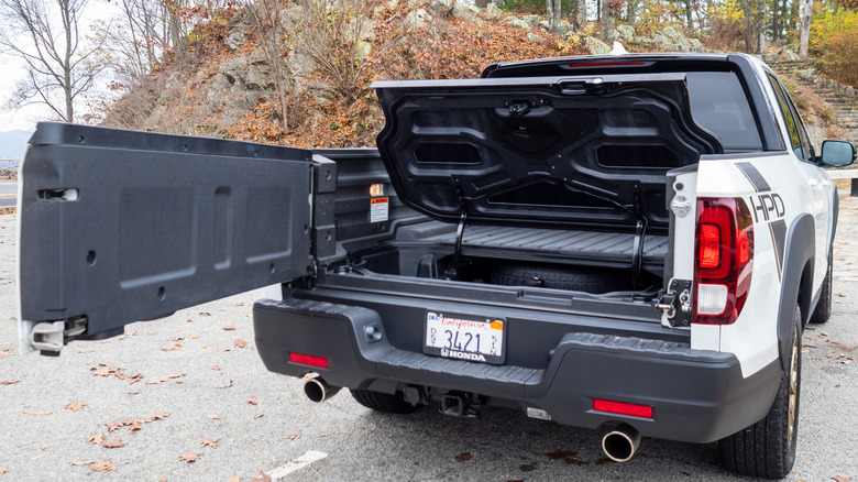 2021 Honda Ridgeline Sport parked with tailgate and trunk lid open