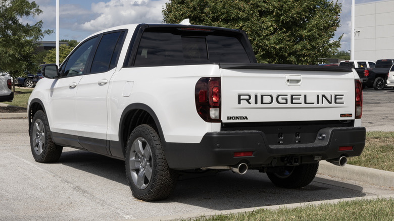 A white Honda Ridgeline AWD TrailSport parked in a parking lot