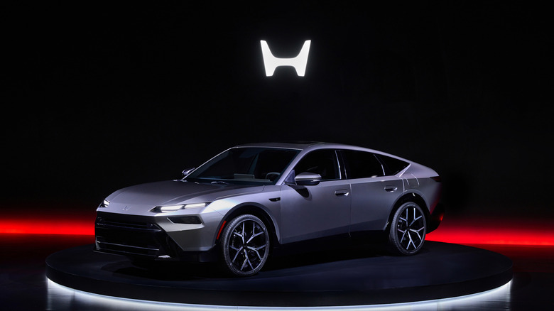Honda Sedan Prototype on display stage, front-left 3/4 view
