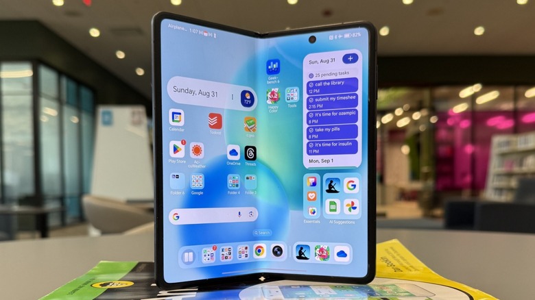 Honor Magic V5 on a book.
