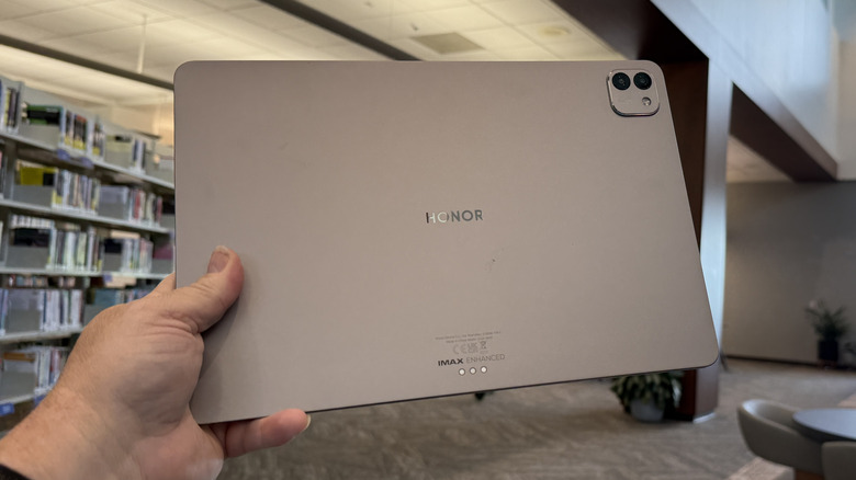 Man holding the Honor MagicPad 3 in his hand