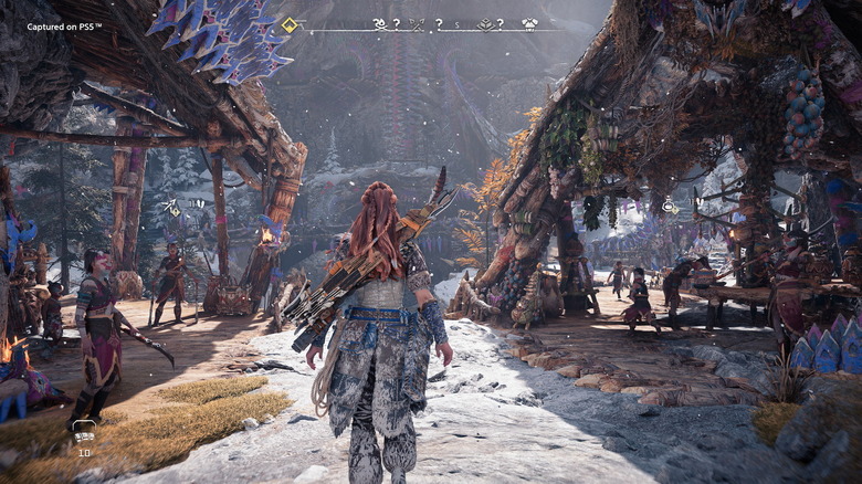 Aloy entering a snowy town