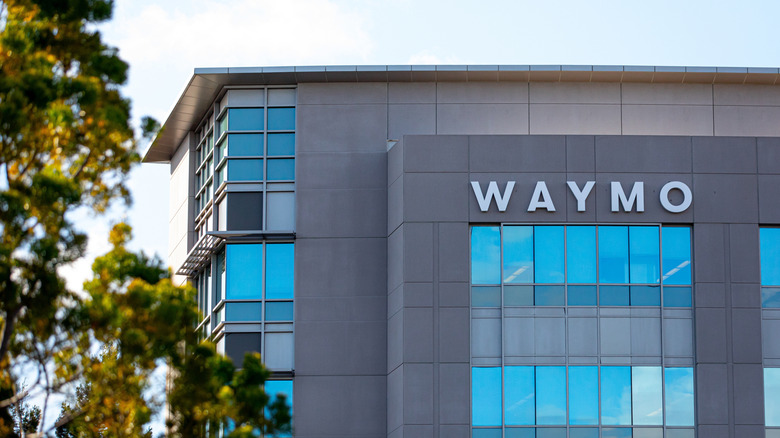A building with Waymo's logo on the facade.