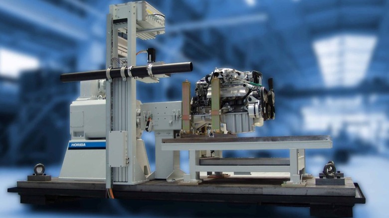 An engine on a stand connected to a dynamometer