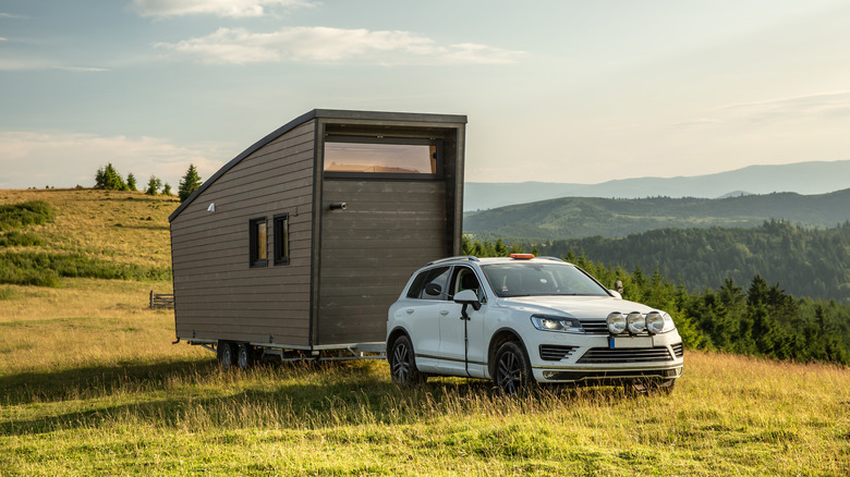 car towing camper trailer outdoors