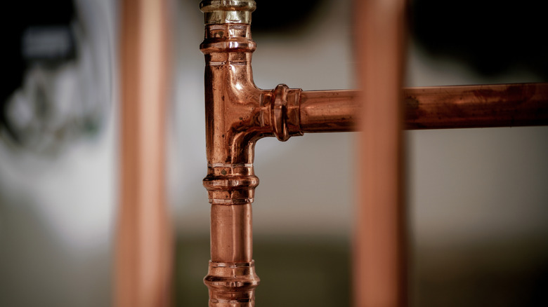 Picture showing copper water pipes inside of a home