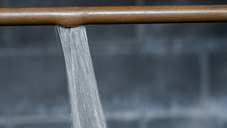 Water spewing from burst pipe