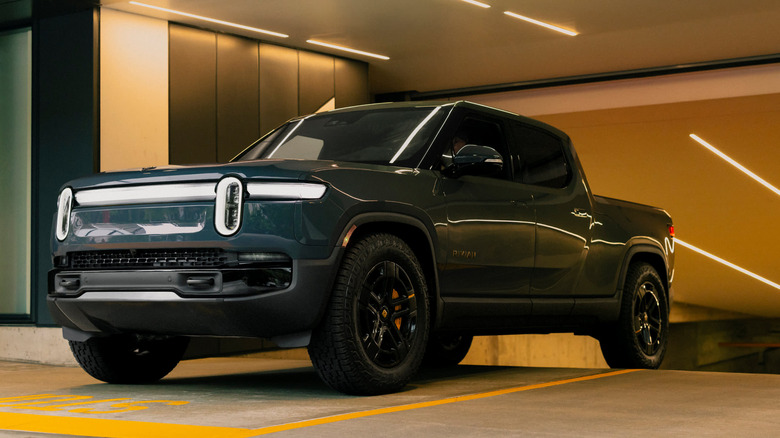 Rivian R1T emerging from an underground parking lot