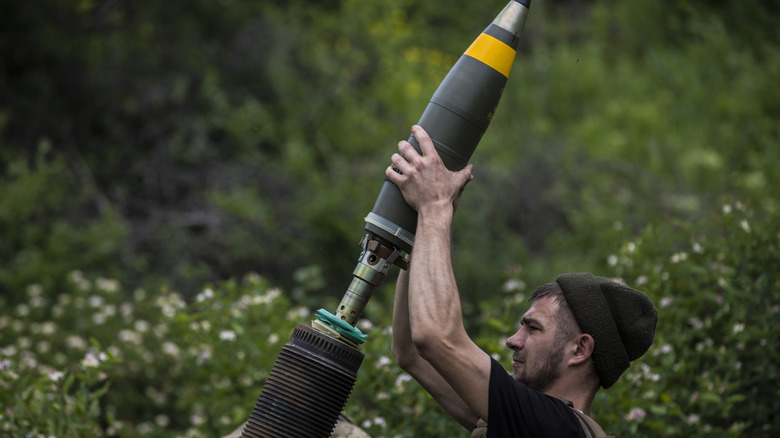 Man loading mortar