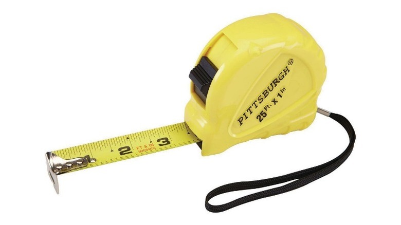 Yellow Pittsburgh tape measurer on white background