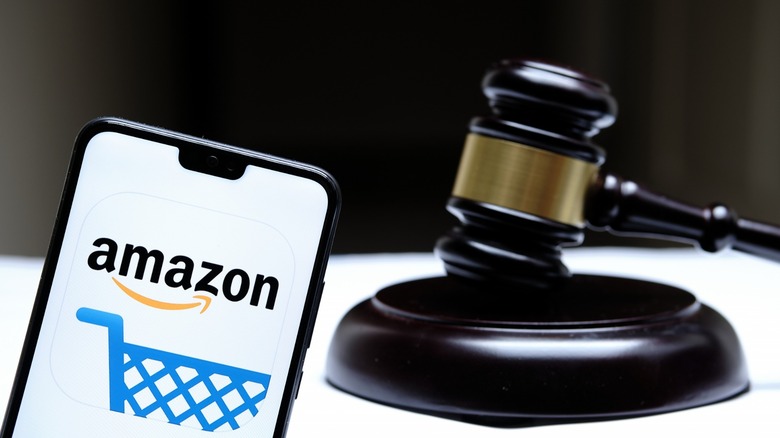 phone with Amazon logo with a gavel behind it