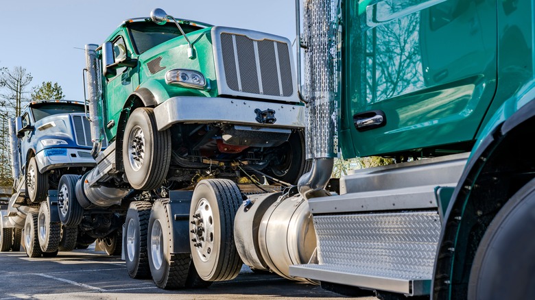 Semi trucks being towed
