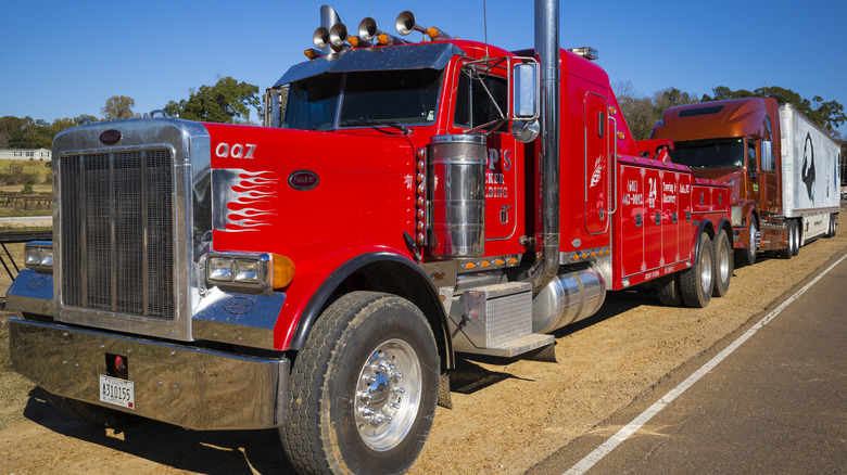 Truck towing a semi truck