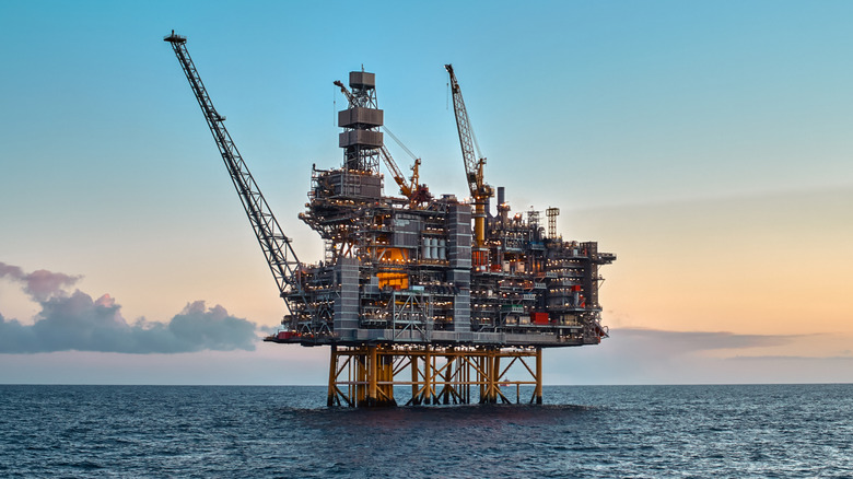 An oil rig in the middle of the ocean.