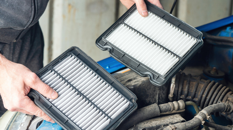 mechanic changing an air filter