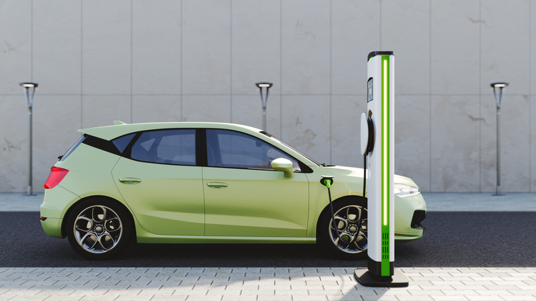 Electric car plugged in charging