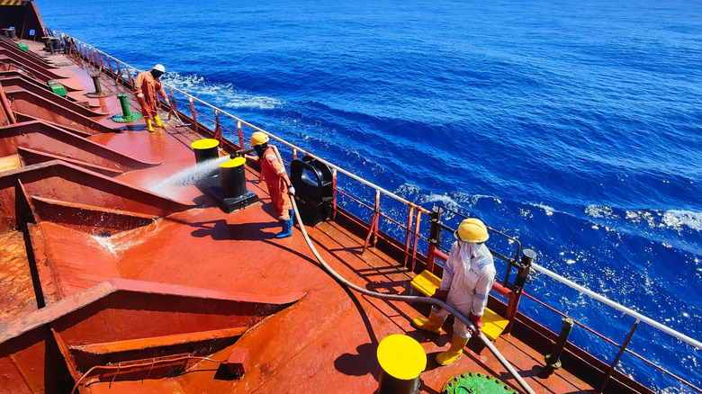Cargo ship crew working on ship deck
