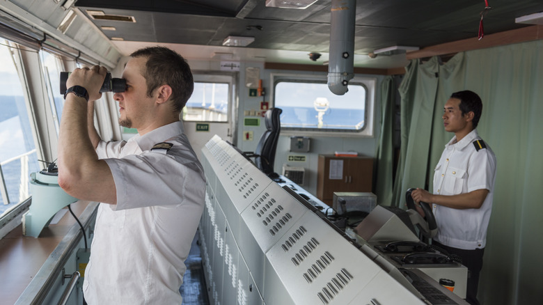 Cargo ship bridge with two ship officers