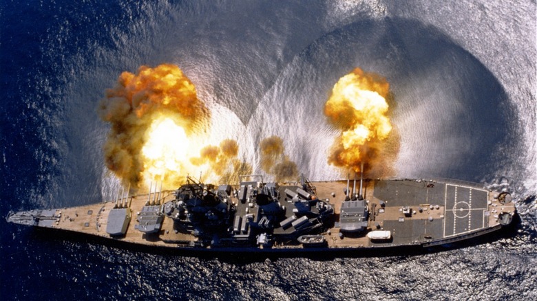 The USS Iowa firing a full broadside of her nine 16″/50 and six 5″/38 guns