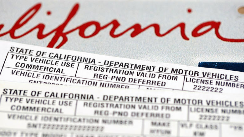 Close-up of California vehicle registration documents on a California license plate