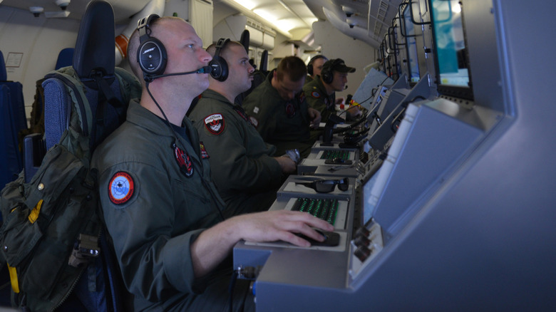 P-8 Poseidon crew watching instruments in the cabin