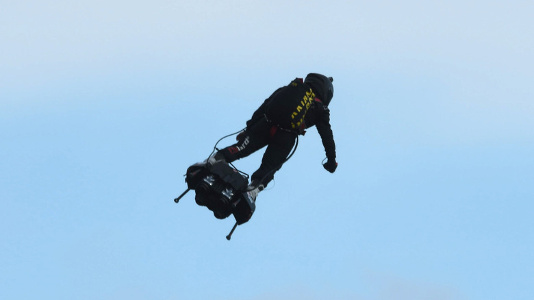 Man flying jetpack