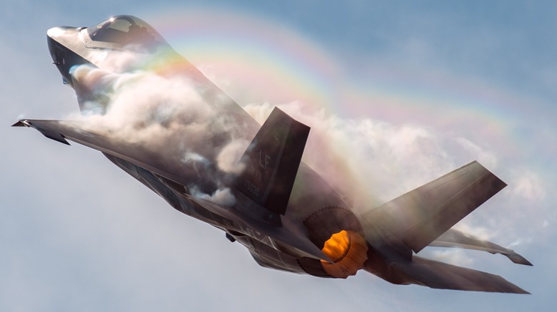 An F-35 with a visible cloud vortex during flight