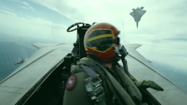A pilot looks back at an American fighter in 