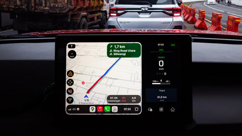 person using Google Maps in Apple CarPlay on the car's infotainment system
