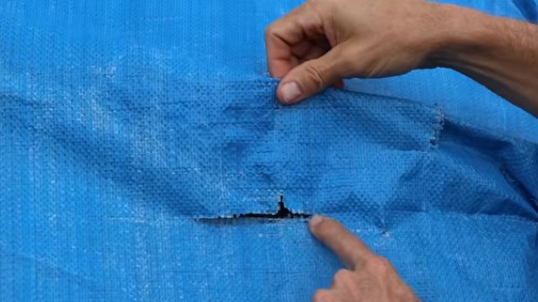 The light-duty Harbor Freight tarp after a year on a hay bale.