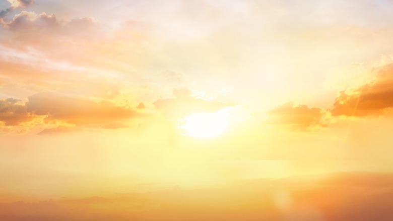 The sun behind clouds
