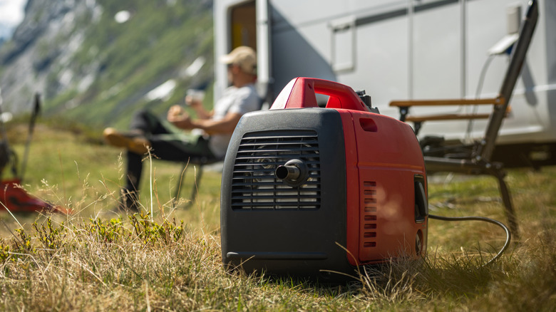 ortable Gasoline Inverted Generator near a Camper Van.