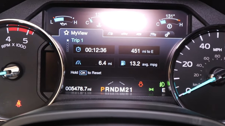 An mpg display on a car dashboard.