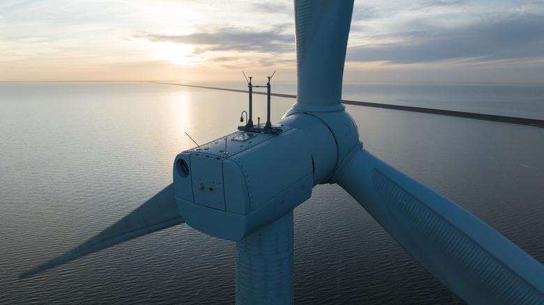 Close-up view of a wind turbine at sea.