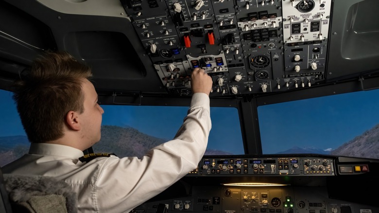 Pilot in the cockpit at night
