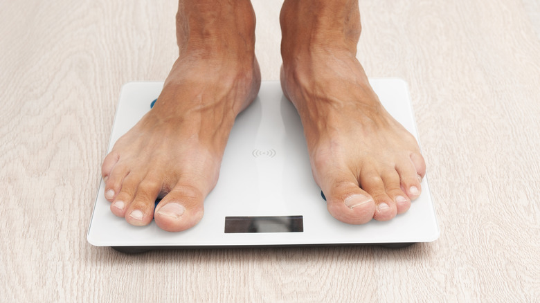 Man standing on a smart scale