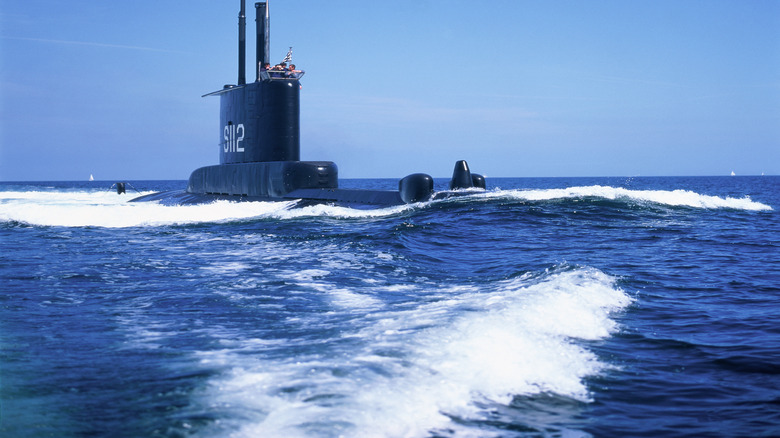 Submarine surfaced in the middle of the ocean
