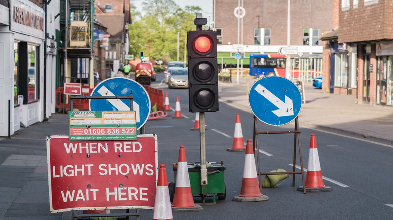 A temporary traffic light shows red