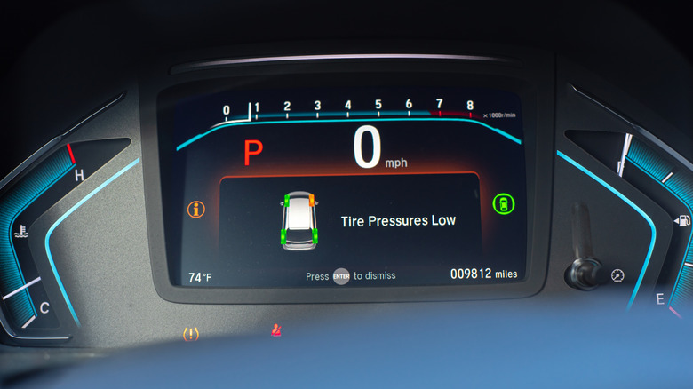 Low tire pressure warning on a car dashboard