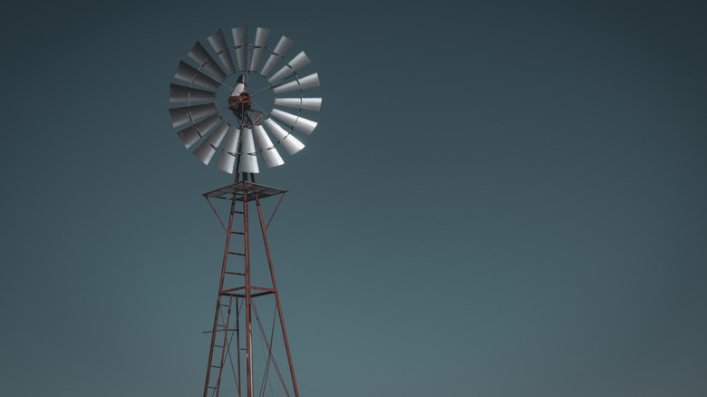 Wind pump against a dark sky in the US