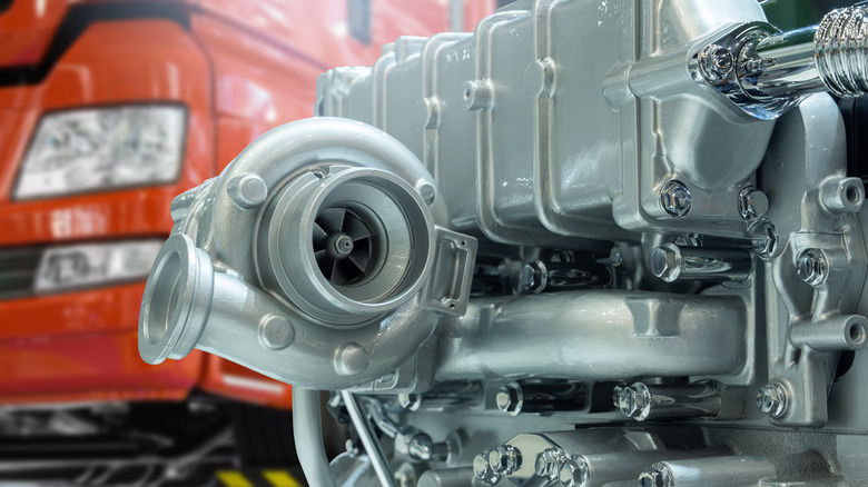 Close-up of diesel engine turbocharger connected to a truck engine