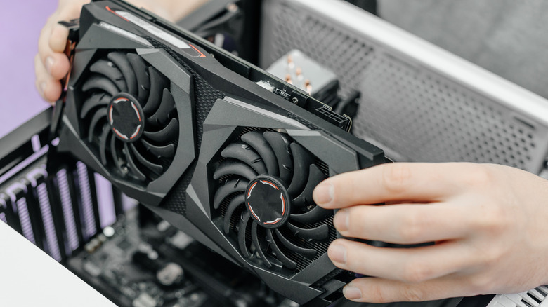 Twin-fan graphics card being installed in a PC