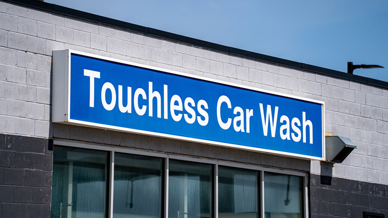 board reading touchless car wash on a building