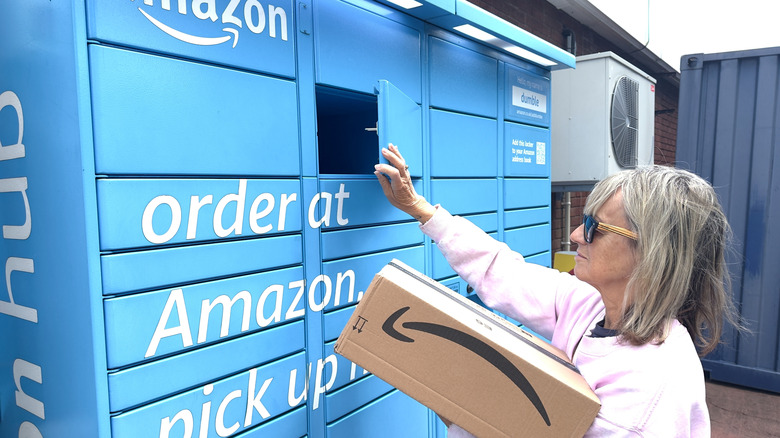 A woman retrieves a package from an Amazon Locker