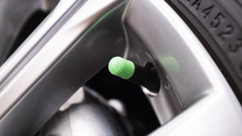 A green valve cap symbolizing nitrogen-filled tires