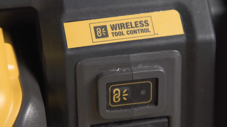 A Wireless Tool Control switch on a DeWalt dust extractor.