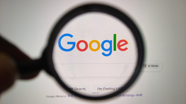 A magnifying glass over the Google logo