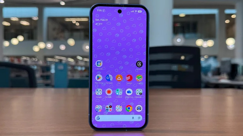 Pixel 10a standing upright on a desk