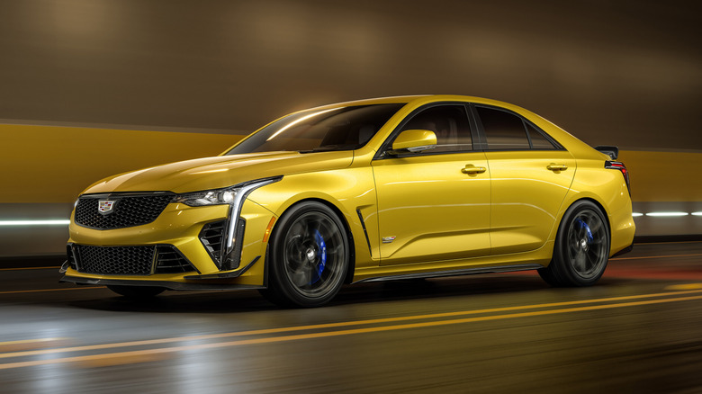A yellow Cadillac CT4-V Blackwing driven through a tunnel.
