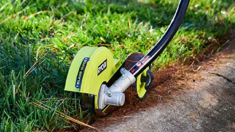 Ryobi Expand-It Universal Edger Attachment along sidewalk